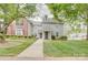 Inviting two-story townhome with a well-manicured lawn and a charming walkway leading to the front door at 2916 Iron Gate Ln, Charlotte, NC 28212