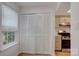 Bright kitchen with white cabinets, stainless steel appliances, and a window overlooking the backyard at 2916 Iron Gate Ln, Charlotte, NC 28212
