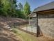 Brick home featuring a fenced-in backyard with a screened porch, perfect for outdoor living at 3002 Portico Pl, Tega Cay, SC 29708
