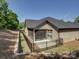 Beautiful backyard with a screened patio, and a black metal fence at 3002 Portico Pl, Tega Cay, SC 29708