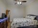 Cozy bedroom with a nautical-themed bed, wood floors, and dresser at 3002 Portico Pl, Tega Cay, SC 29708