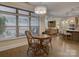 Bright dining area with a wooden table and chairs, open to the kitchen and living room at 3002 Portico Pl, Tega Cay, SC 29708