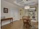 Dining area featuring a classic wooden table and chairs, complemented by elegant decor at 3002 Portico Pl, Tega Cay, SC 29708