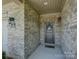 Inviting front entrance with charming decorations, brickwork and welcoming lighting at 3002 Portico Pl, Tega Cay, SC 29708