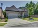 Charming single-Gathering home with a well-manicured front yard and a two-car garage at 3002 Portico Pl, Tega Cay, SC 29708