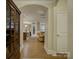 Elegant hallway featuring hardwood floors and an open view into the living area at 3002 Portico Pl, Tega Cay, SC 29708