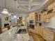 The kitchen features a spacious island, stainless steel appliances, and a view into the living room at 3002 Portico Pl, Tega Cay, SC 29708