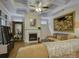 Cozy living room featuring a fireplace, comfortable seating, and ample natural light at 3002 Portico Pl, Tega Cay, SC 29708