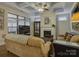 Stylish living room with coffered ceilings, fireplace, and large windows at 3002 Portico Pl, Tega Cay, SC 29708