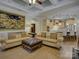 Open-concept living room featuring two sofas, a ceiling fan, and seamless flow into the kitchen at 3002 Portico Pl, Tega Cay, SC 29708