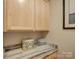 Pantry with granite countertop, a container, and water bottles at 3002 Portico Pl, Tega Cay, SC 29708
