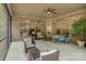 Screened patio with ceiling fan, privacy screens, and both a dining and seating area at 3002 Portico Pl, Tega Cay, SC 29708