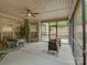 Screened patio with ceiling fan and an outdoor dining and seating area at 3002 Portico Pl, Tega Cay, SC 29708