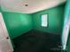 Standard bedroom with green painted walls and natural light from the windows at 315 Broad Sw Dr, Concord, NC 28025