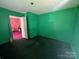 Bedroom with classic green walls, bright light, and original features at 315 Broad Sw Dr, Concord, NC 28025