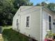 View of the side of the home with neutral siding, showcasing its design at 315 Broad Sw Dr, Concord, NC 28025