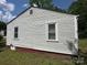 A simple yet functional side of the house with vinyl siding, showcasing its architecture at 315 Broad Sw Dr, Concord, NC 28025