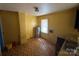 Unfinished kitchen area features a water heater, patterned linoleum flooring, and essential sink at 315 Broad Sw Dr, Concord, NC 28025