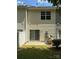 A fenced in backyard with sliding glass door and patio at 3527 Creeping Flora Ln, Charlotte, NC 28216