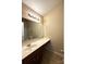 Bathroom featuring a vanity with a spacious countertop and a large mirror, next to a shower-tub combo at 3527 Creeping Flora Ln, Charlotte, NC 28216