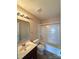 Bathroom showcasing a vanity with a mirror, a toilet, and a shower-tub combination at 3527 Creeping Flora Ln, Charlotte, NC 28216