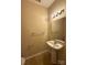 Clean bathroom offering a pedestal sink and contemporary lighting at 3527 Creeping Flora Ln, Charlotte, NC 28216