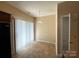 Bright dining area featuring tile floors and a sliding door with vertical blinds for natural light at 3527 Creeping Flora Ln, Charlotte, NC 28216