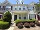 Charming townhome showcasing a well-manicured front yard and inviting entrance at 3527 Creeping Flora Ln, Charlotte, NC 28216