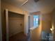 Upper hallway leads to bedroom and linen closet with washer and dryer hookups at 3527 Creeping Flora Ln, Charlotte, NC 28216
