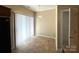 Bright kitchen nook with tile floors and access to a pantry and natural light from the sliding glass door at 3527 Creeping Flora Ln, Charlotte, NC 28216