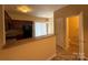 Functional kitchen with ample counter space, wooden cabinets, and a view into the adjacent dining area at 3527 Creeping Flora Ln, Charlotte, NC 28216