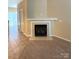 Comfortable living room highlighting a marble fireplace and tile flooring at 3527 Creeping Flora Ln, Charlotte, NC 28216