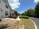 A tree lined sidewalk with a view of the townhomes at 3527 Creeping Flora Ln, Charlotte, NC 28216