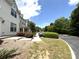 Charming townhomes along the street with sidewalks and manicured landscaping at 3527 Creeping Flora Ln, Charlotte, NC 28216