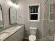 Bathroom featuring double sinks with granite countertops and a large vanity at 404 N Peterson St, Stanley, NC 28164