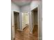 Well-lit bathroom features a modern vanity with granite countertop, toilet and tub with tiled shower at 404 N Peterson St, Stanley, NC 28164