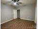 Bedroom with wood-look flooring, neutral walls, and a standard double door closet at 404 N Peterson St, Stanley, NC 28164