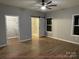 Spacious bedroom with a barn door, large windows, and ample closet space at 404 N Peterson St, Stanley, NC 28164