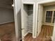 Organized closet with multiple shelves and a view into an adjacent room with natural light at 404 N Peterson St, Stanley, NC 28164
