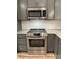 Updated kitchen showcasing stainless steel oven and granite countertops at 404 N Peterson St, Stanley, NC 28164