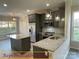 Charming kitchen with stainless steel appliances and granite countertops at 404 N Peterson St, Stanley, NC 28164