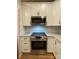 Updated kitchen featuring stainless steel oven and white subway tile at 404 N Peterson St, Stanley, NC 28164
