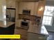Modern kitchen featuring stainless steel appliances, granite countertops, and ample cabinet space at 404 N Peterson St, Stanley, NC 28164