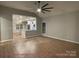 Open-concept living room with hard wood floors, seamlessly connected to the modern kitchen at 404 N Peterson St, Stanley, NC 28164
