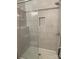 Elegant walk-in shower with glass doors, rainfall showerhead, and tiled walls offer a spa-like experience at 404 N Peterson St, Stanley, NC 28164