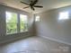 Bright bedroom with large windows overlooking lush trees at 408 Nathaniel Way # Brx0053, Charlotte, NC 28213