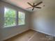 Bedroom with ample natural light from the windows, featuring a ceiling fan at 408 Nathaniel Way # Brx0053, Charlotte, NC 28213