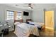 Cozy bedroom with two twin beds, a ceiling fan, and natural light, perfect for shared space or guests at 430 Edgegreen Dr, Charlotte, NC 28217