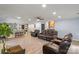 Living room featuring hardwood floors, a ceiling fan, views of the kitchen, and a comfortable seating arrangement at 430 Edgegreen Dr, Charlotte, NC 28217