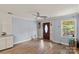 Welcoming living room featuring hardwood floors, natural light, and modern ceiling fan for comfortable living at 430 Edgegreen Dr, Charlotte, NC 28217